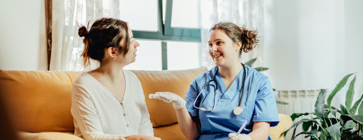 A nurse talking with a patient