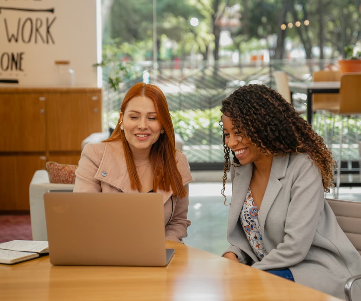 Two healthcare colleagues reviewing information together