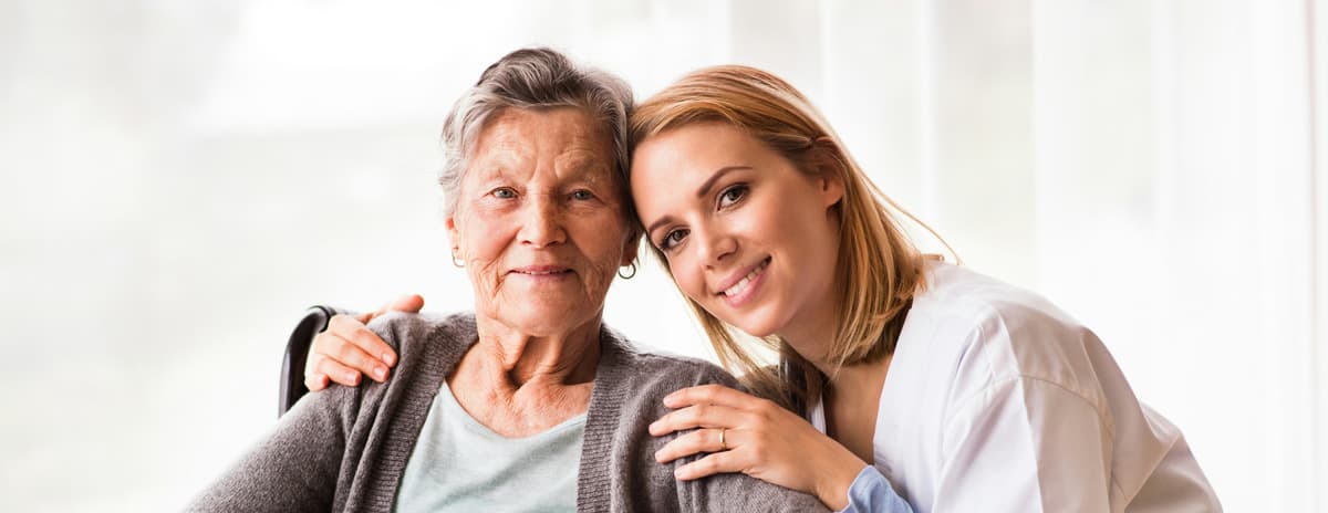 Two older adults smiling together