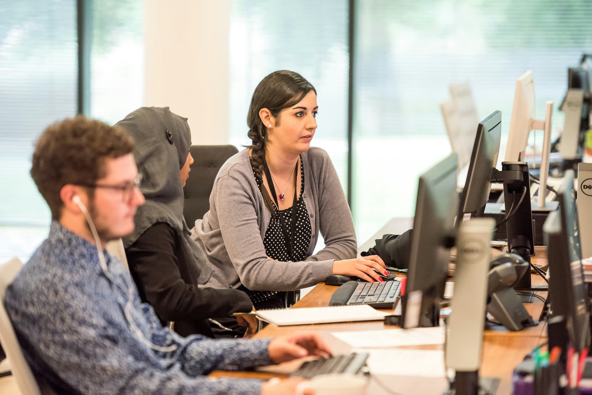 A team member working at a computer