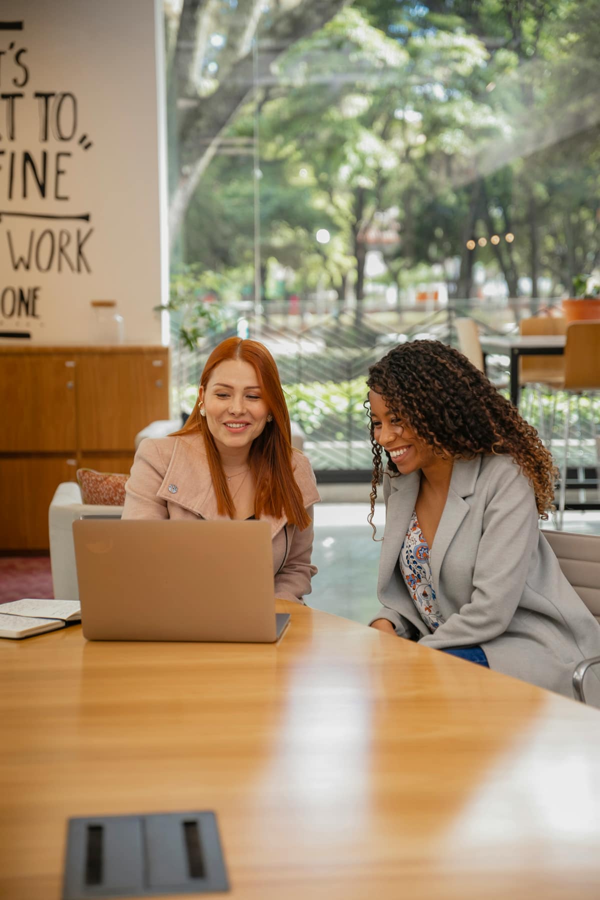 Two healthcare colleagues reviewing information together
